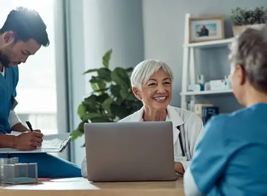 Doctors smiling in conversation